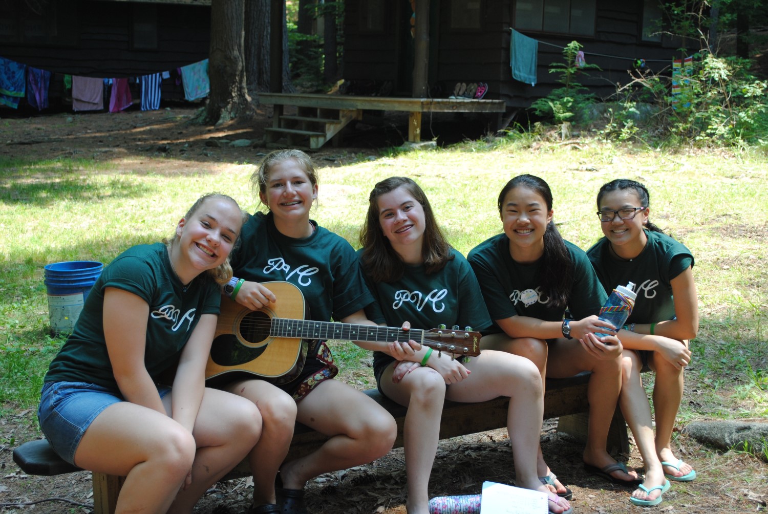 camp girls with guitar